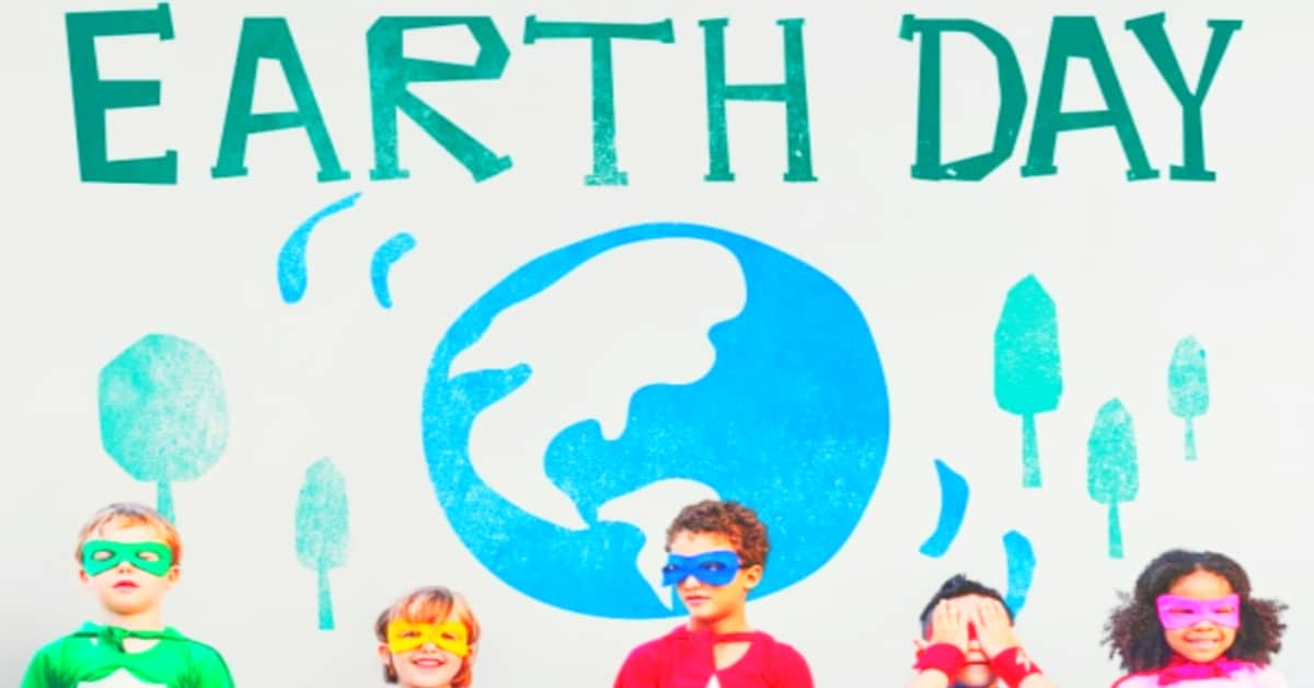 Meaningful Earth Day Lessons Plans and Fun Earth Day Activities for Kids dressed in super hero costumes standing under an art earth 