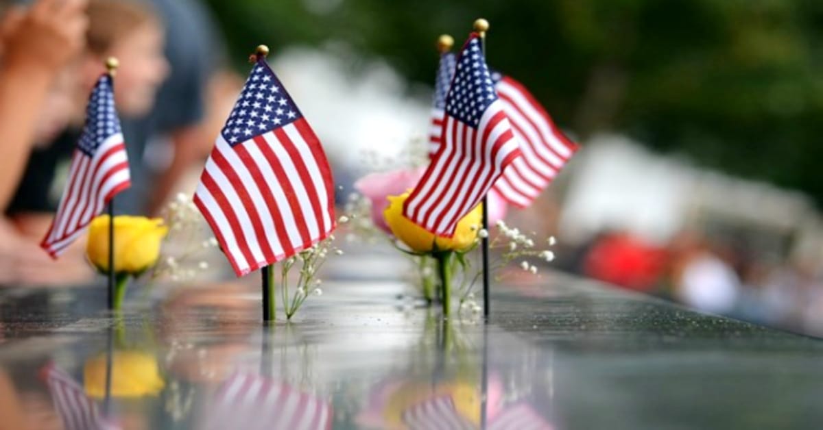 Teaching 9/11 for kids lessons mini American flags and yellow roses on September 11 memorial