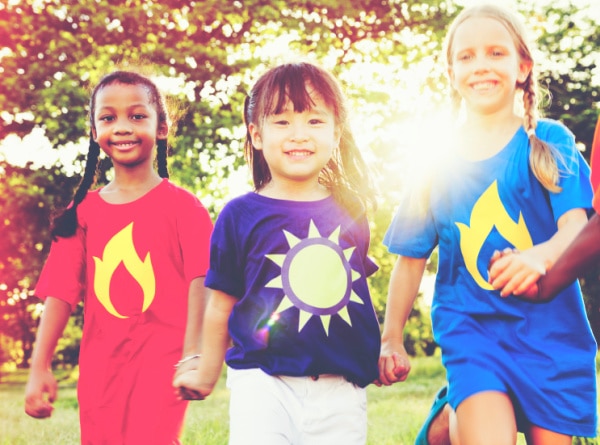Women’s History Month for kids activities (Womens History Month lessons and ideas): black, asian, white girls smiling and running outside during Women in History month activities