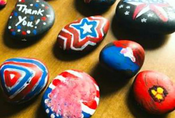 How To Do Kindness Rocks different colored painted rocks on table