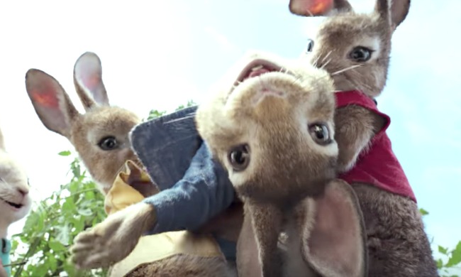 Peter Rabbit activities: Peter Rabbit character smiling in the arms of another rabbit character (screen shot from movie)