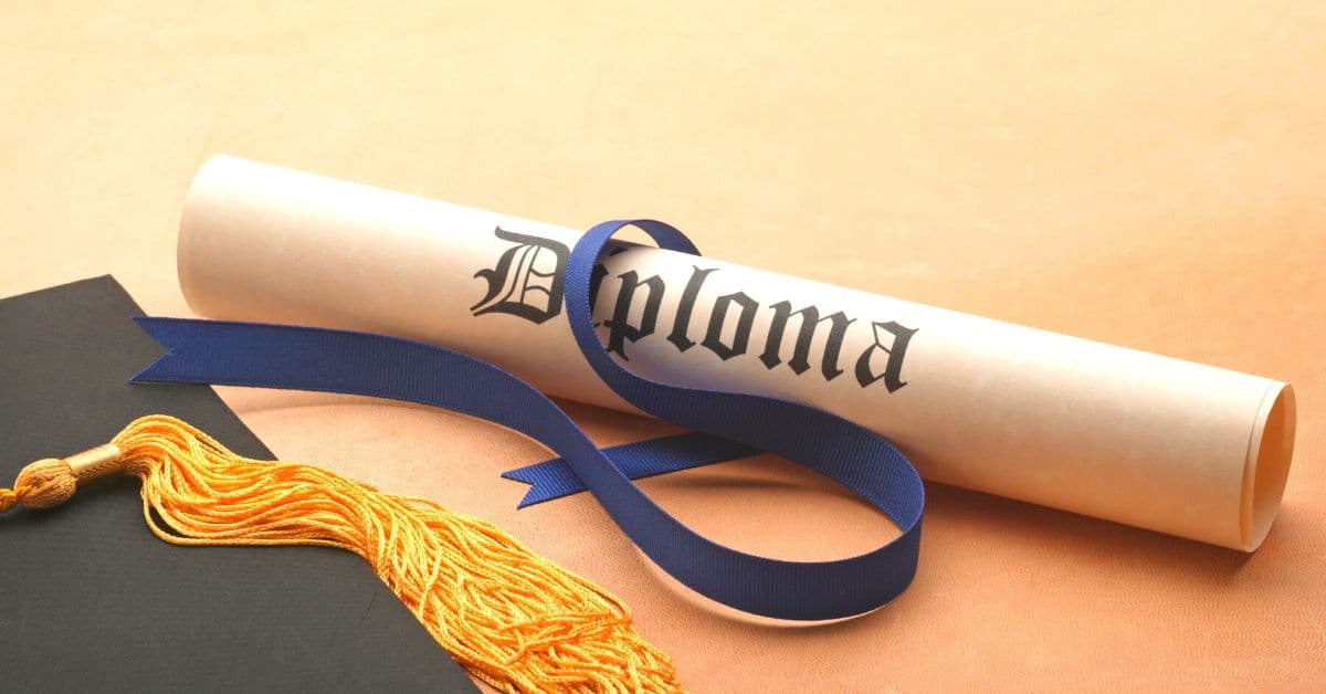 How does a homeschooler get a diploma? Homeschool Diploma Requirements for Homeschooling Graduation homeschool graduation cap and homeschool diploma on a table