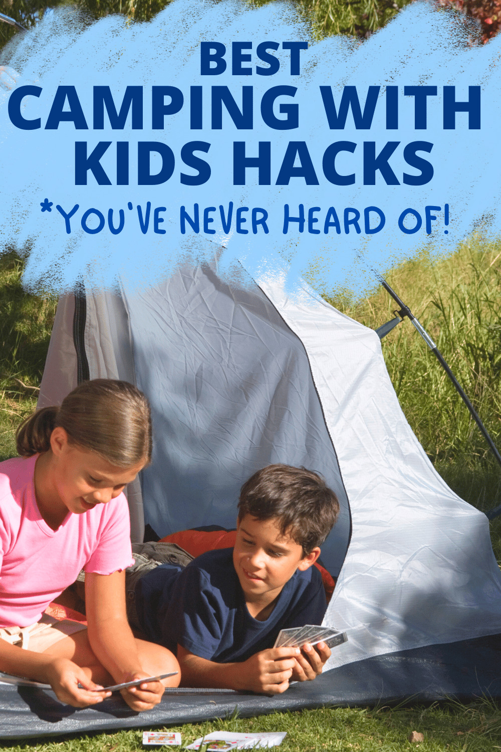 BEST CAMPING HACKS WITH KIDS boy tween and girl tween playing cards in a camping tent