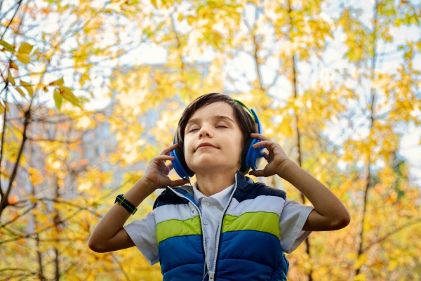 #audiobooks #audio #books #childrensbook #childrensbooks #reading #readinglist #specialneeds #specialeducation #education #technology #dyslexia #homeschool #homeschooling boy in woods with headphones on listening with eyes closed