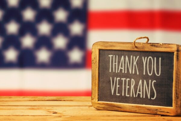 Veterans Day activities for students thank you veterans sign on a table in front of American flag