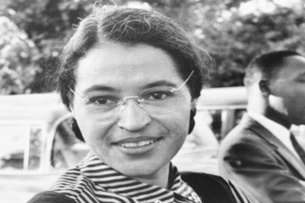 Rosa Parks on the bus lesson plans: black and white image of Rosa Parks face with Dr Martin Luther King Jr in background
